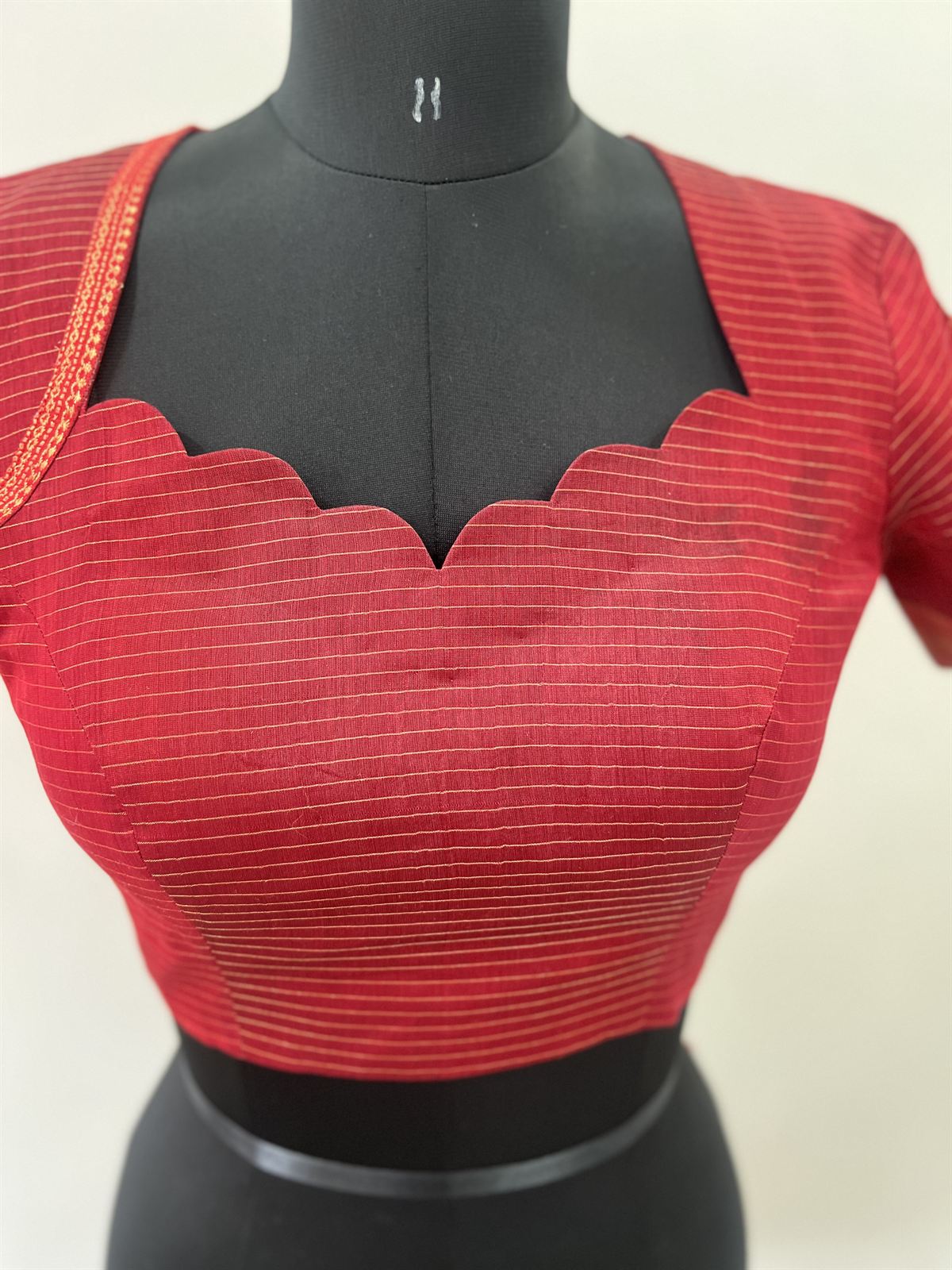 Red striped blouse with a scalloped sweetheart neckline
